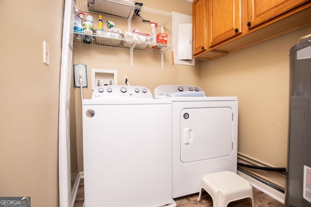 washroom with independent washer and dryer and cabinets