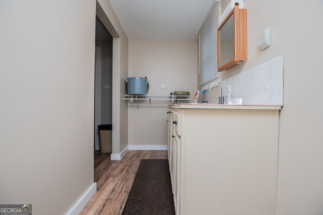 kitchen featuring sink and hardwood / wood-style flooring