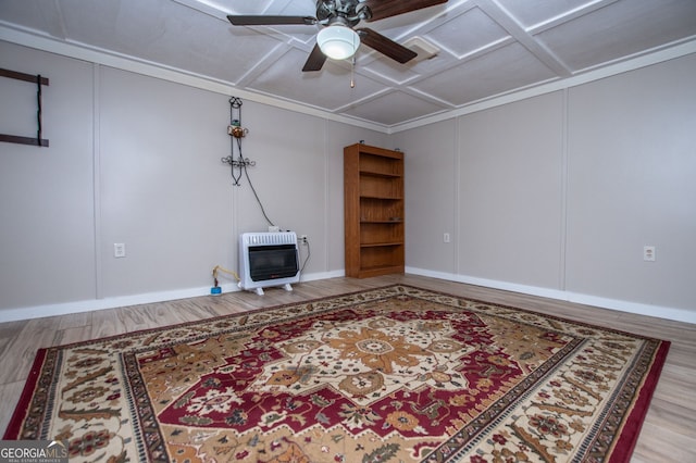 living room featuring heating unit, ceiling fan, coffered ceiling, and hardwood / wood-style flooring