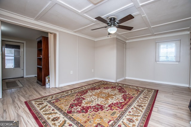 spare room with coffered ceiling, light hardwood / wood-style flooring, and ceiling fan