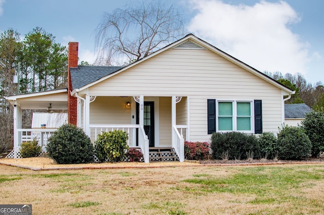 view of front of home featuring a front lawn and a porch