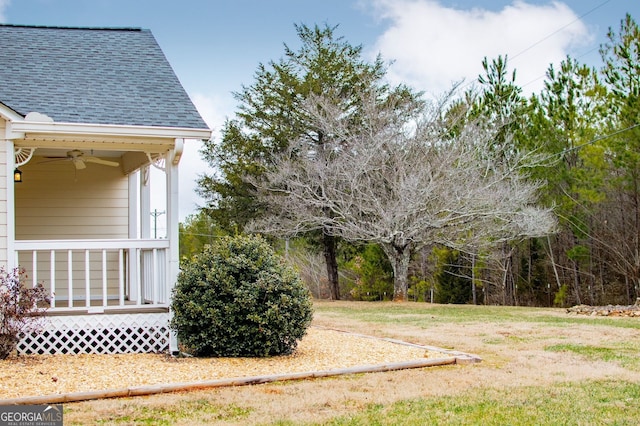 view of yard featuring ceiling fan