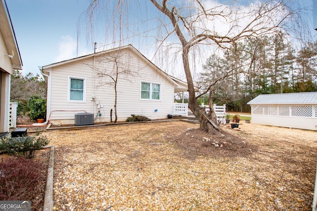 back of property featuring cooling unit