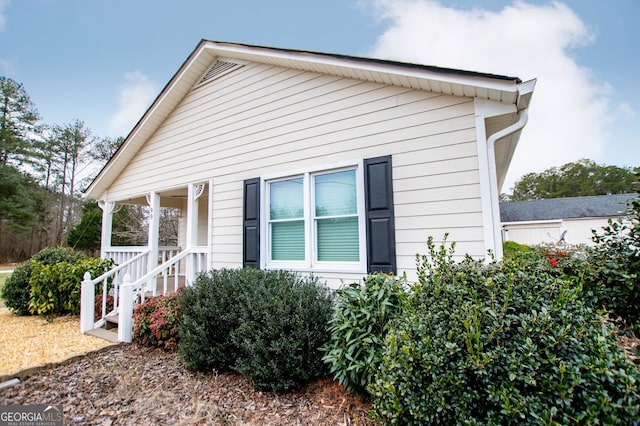 view of home's exterior with a porch