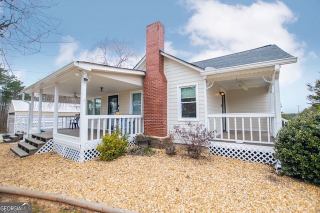 exterior space with a porch and ceiling fan