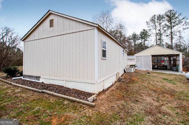 view of side of home featuring a carport