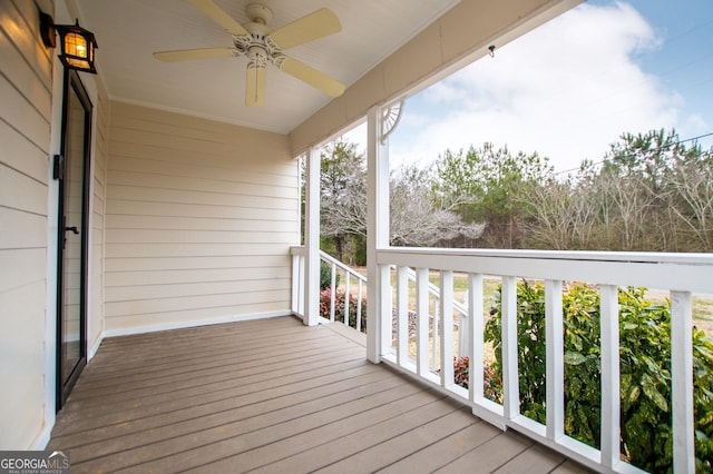 wooden terrace with ceiling fan