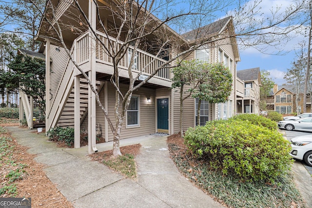 view of front of property featuring stairway