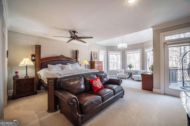 carpeted bedroom featuring crown molding, ceiling fan with notable chandelier, and access to outside