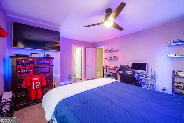 bedroom featuring ceiling fan and carpet