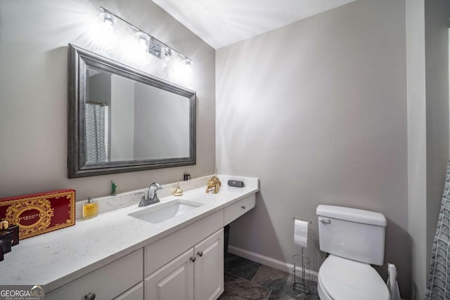 bathroom with toilet and vanity