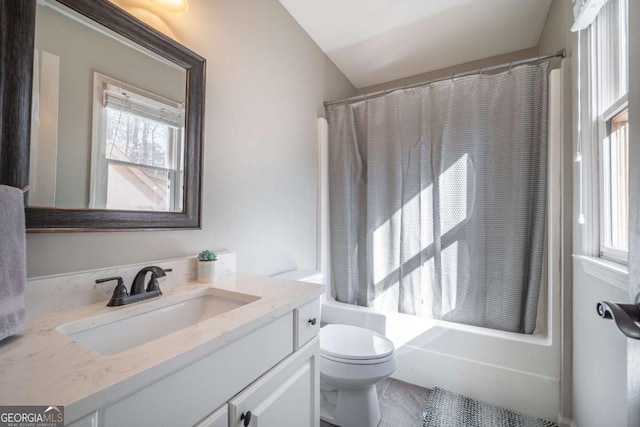 full bathroom featuring shower / bath combo with shower curtain, a wealth of natural light, toilet, and vanity