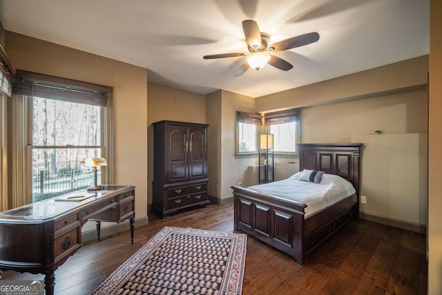 bedroom featuring dark wood-type flooring and ceiling fan