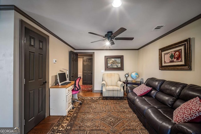 living room featuring ornamental molding, ceiling fan, and dark hardwood / wood-style flooring