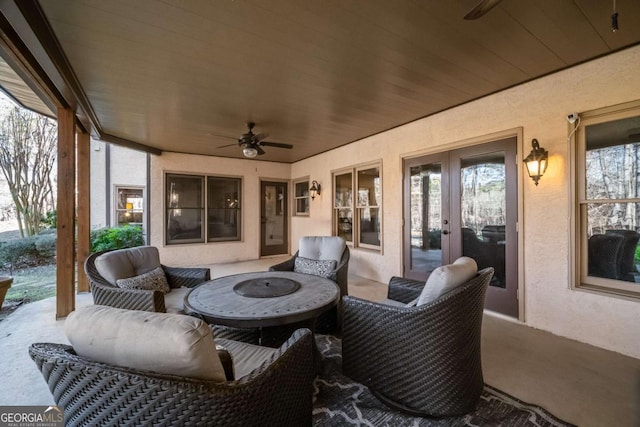 view of patio / terrace featuring ceiling fan and french doors