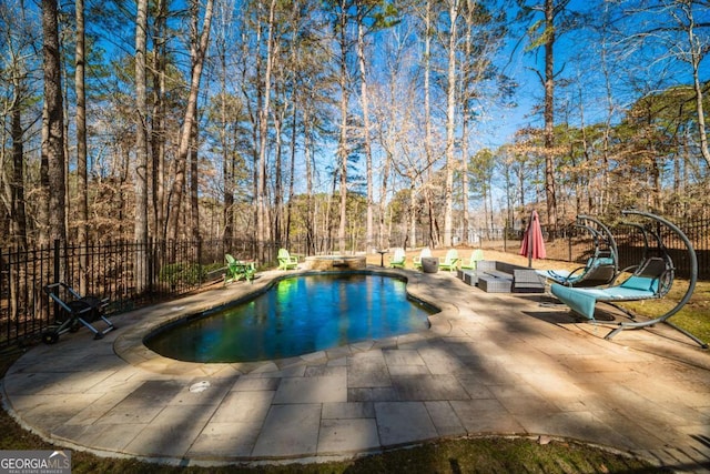 view of swimming pool featuring a patio