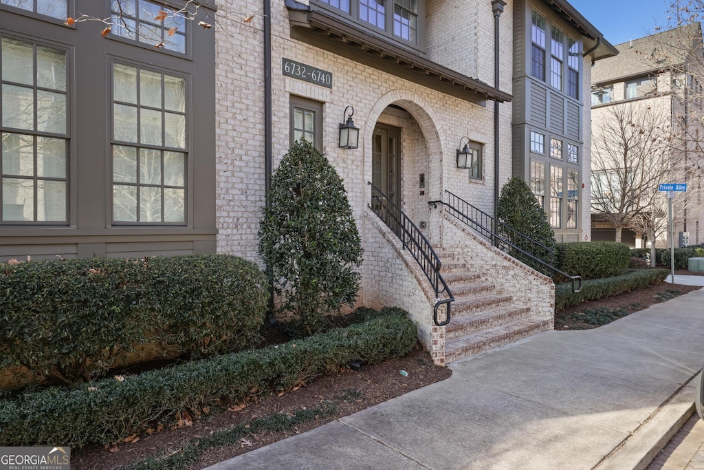 property entrance with brick siding