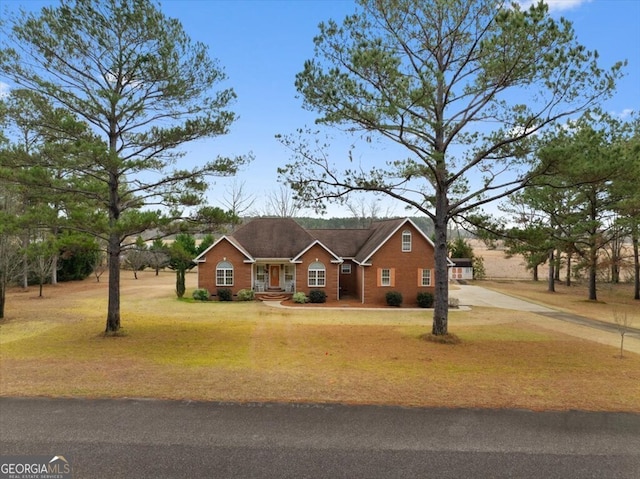 ranch-style house with a front lawn