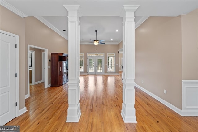 unfurnished living room with crown molding and ornate columns