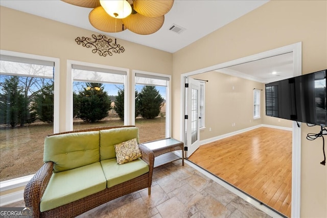 interior space featuring ceiling fan