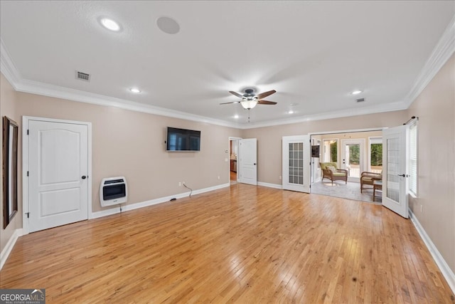 unfurnished living room with ceiling fan, french doors, light wood-type flooring, heating unit, and ornamental molding