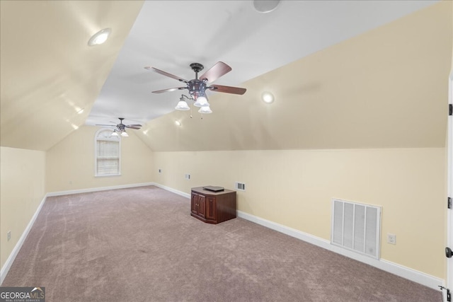 additional living space with light carpet, vaulted ceiling, and ceiling fan