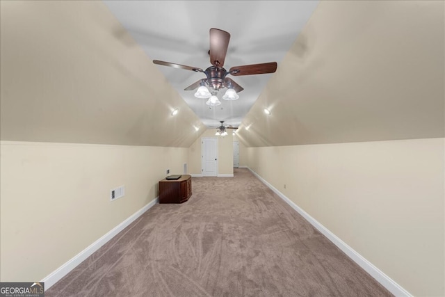 additional living space with ceiling fan, light colored carpet, and lofted ceiling