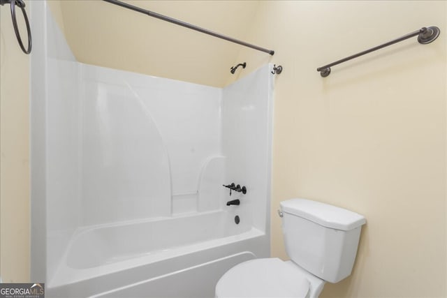 bathroom featuring toilet and shower / washtub combination