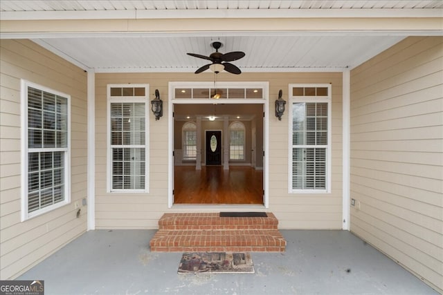 entrance to property featuring ceiling fan