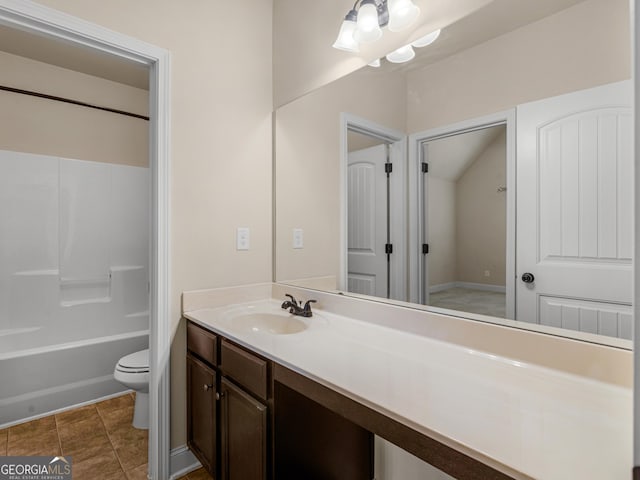 bathroom featuring tile patterned flooring, vanity, toilet, and shower / bathtub combination