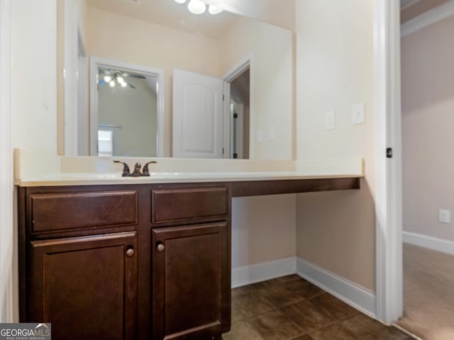 bathroom featuring vanity and baseboards