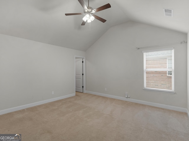 bonus room with light colored carpet, visible vents, lofted ceiling, and baseboards