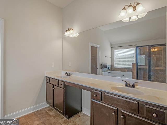 full bath with a garden tub, a sink, baseboards, and double vanity