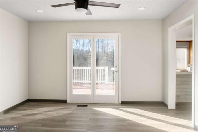 entryway with light wood-type flooring and ceiling fan