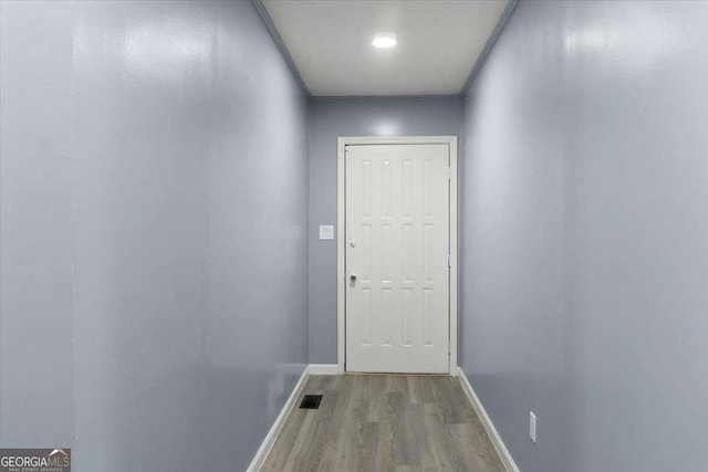 doorway to outside with light wood-type flooring