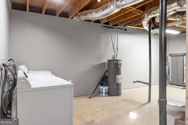 basement featuring water heater and washer and dryer