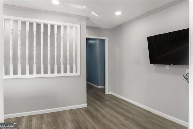 interior space with wood-type flooring and ornamental molding