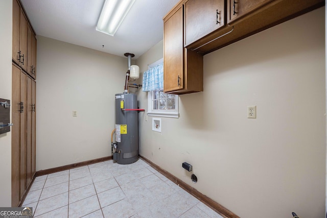 interior space featuring washer hookup, gas water heater, and cabinets