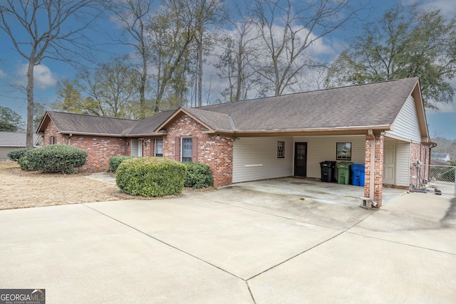 single story home featuring a carport