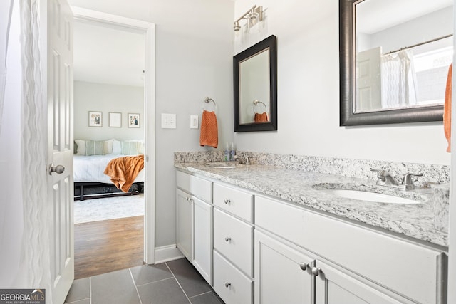 bathroom featuring tile patterned floors and vanity