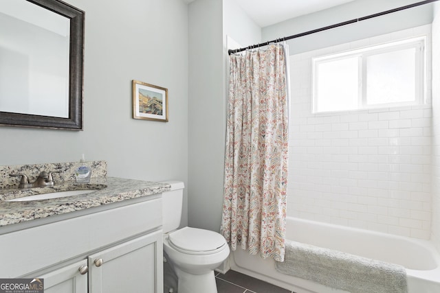 full bathroom featuring toilet, tile patterned floors, vanity, and shower / bathtub combination with curtain