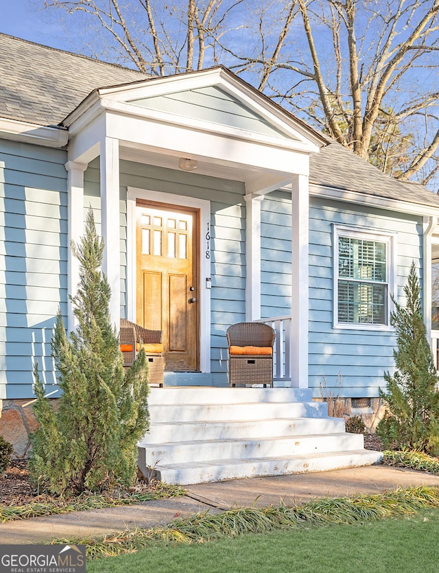 doorway to property with covered porch