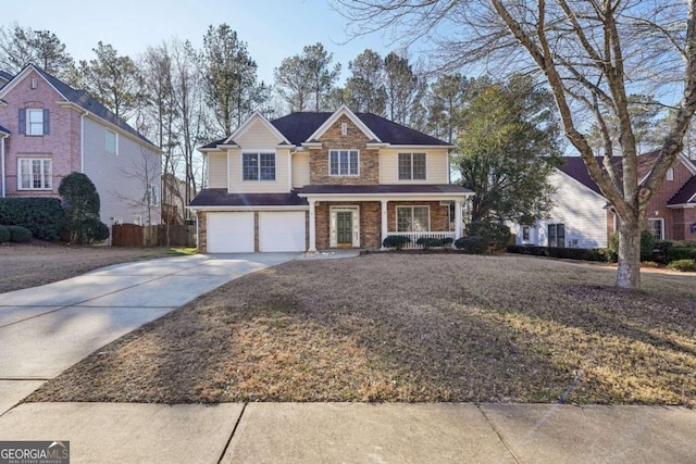 front of property featuring a garage and a porch