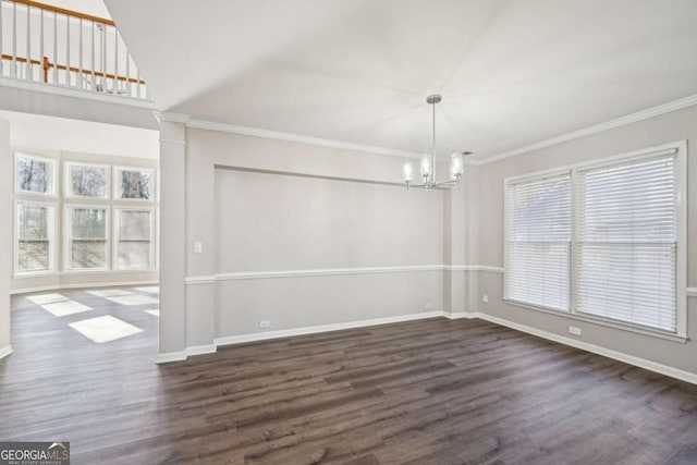 unfurnished dining area featuring plenty of natural light, dark hardwood / wood-style flooring, crown molding, and a notable chandelier