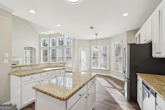 kitchen featuring a center island, white cabinets, decorative light fixtures, dark wood-type flooring, and stainless steel appliances