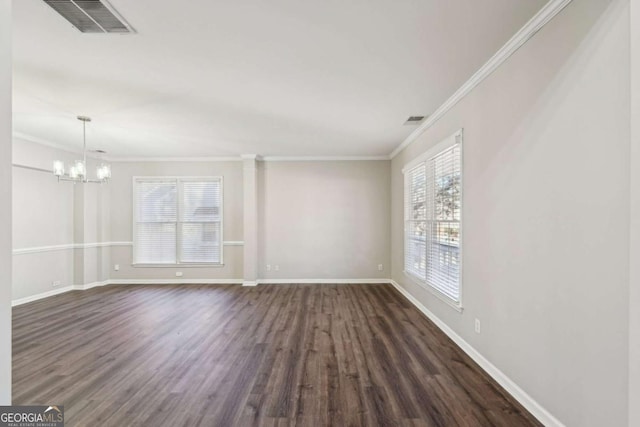 unfurnished room with crown molding, dark wood-type flooring, and a chandelier