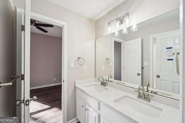 bathroom featuring vanity, ceiling fan, and hardwood / wood-style flooring