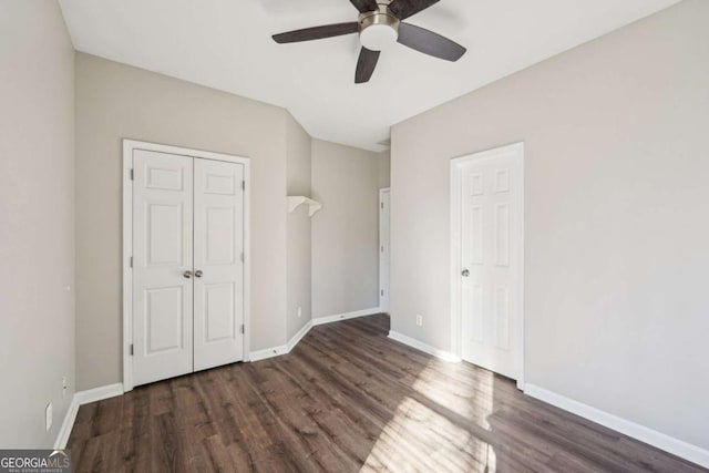 unfurnished bedroom with ceiling fan and dark hardwood / wood-style flooring