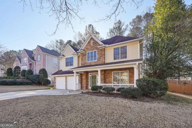 view of front of home with covered porch and a garage