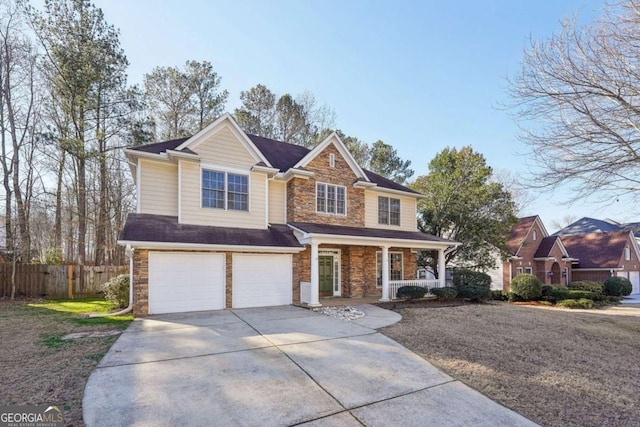 view of front of house with a porch and a garage